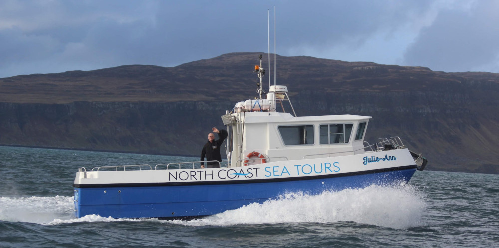 Tony waving from aboard Julie-Ann