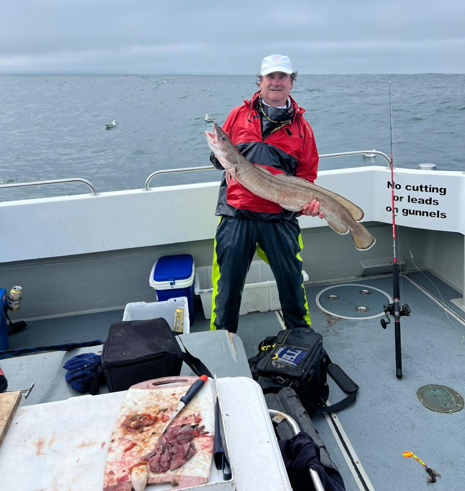 man holds large fish
