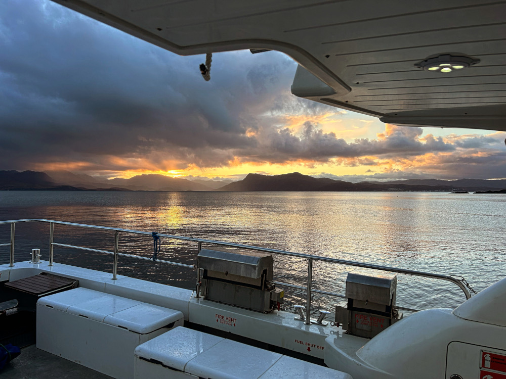 sunset over mountains from deck of Julie-Ann